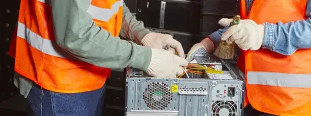 2 technicians refurbishing material